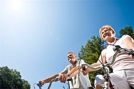 simsearch:6113-07146821,k - Couple cycling, low view Stock Photo - Premium Royalty-Free, Code: 649-02054113