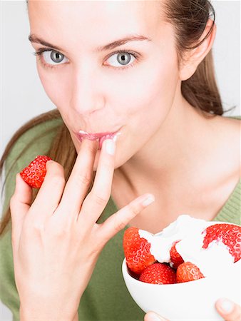 Woman eating strawberries Stock Photo - Premium Royalty-Free, Code: 649-02054394