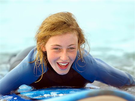 surfboard close up - Female on surfboard taking small wave Stock Photo - Premium Royalty-Free, Code: 649-02054531