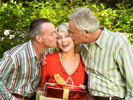 flirt senior woman - Mature woman being kissed by two men Stock Photo - Premium Royalty-Free, Code: 649-02054591
