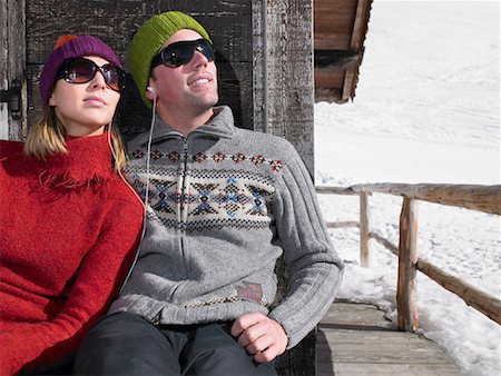 snowy chalet - Couple listening to music at chalet Stock Photo - Premium Royalty-Free, Code: 649-02054882