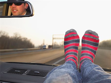 Feet on dashboard Stock Photo - Premium Royalty-Free, Code: 649-02055003