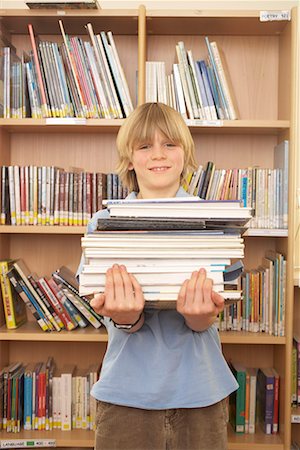 simsearch:614-06895765,k - Boy carrying books, smiling Stock Photo - Premium Royalty-Free, Code: 649-02055445