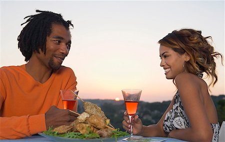 simsearch:649-05556305,k - Man and woman at a barbecue at sunset Stock Photo - Premium Royalty-Free, Code: 649-02053823