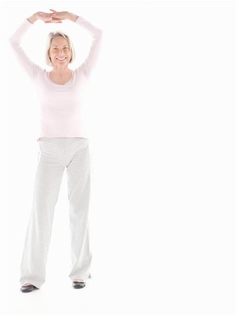 Mature woman stretching Stock Photo - Premium Royalty-Free, Code: 649-02199751