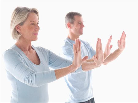 Mature couple doing yoga Stock Photo - Premium Royalty-Free, Code: 649-02199760