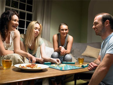 entertainment and game - Four young people playing scrabble Stock Photo - Premium Royalty-Free, Code: 649-02290642