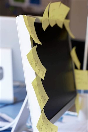 Post it notes on computer screen Stock Photo - Premium Royalty-Free, Code: 649-02424233