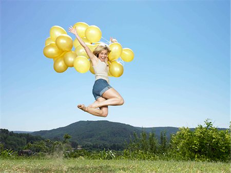 simsearch:649-03009497,k - Girl jumping with balloons Stock Photo - Premium Royalty-Free, Code: 649-02424500