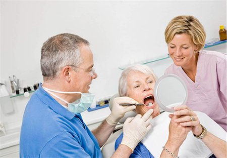 dental work - Dentist and assistant working on patient Stock Photo - Premium Royalty-Free, Code: 649-02665305