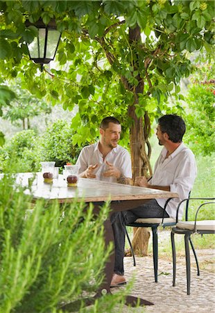 estate - Men relaxing at table in a garden Stock Photo - Premium Royalty-Free, Code: 649-02665907