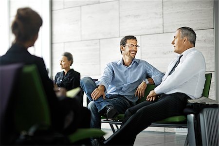 Men talking in waiting room Stock Photo - Premium Royalty-Free, Code: 649-02666888