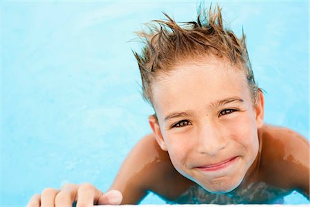 preteen swim - Boy smiling into camera Stock Photo - Premium Royalty-Free, Code: 649-02731264
