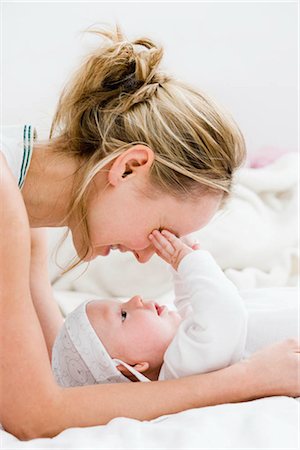 simsearch:400-05119279,k - Mother hugging her baby Stock Photo - Premium Royalty-Free, Code: 649-02731346