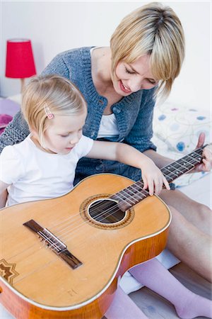 simsearch:628-07072734,k - Girl and woman playing with a guitar Stock Photo - Premium Royalty-Free, Code: 649-02731454