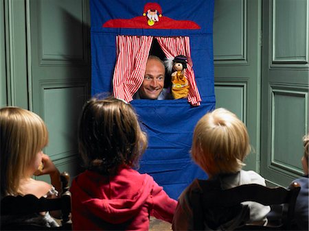 Kids watching a puppet show Stock Photo - Premium Royalty-Free, Code: 649-02731591