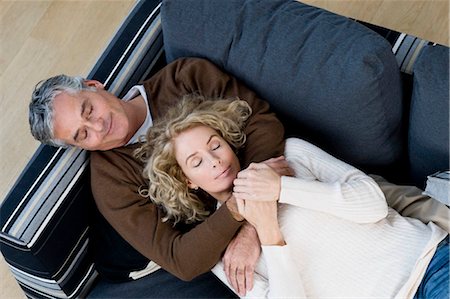simsearch:6113-07790495,k - Man and woman relaxing on sofa Stock Photo - Premium Royalty-Free, Code: 649-02732394