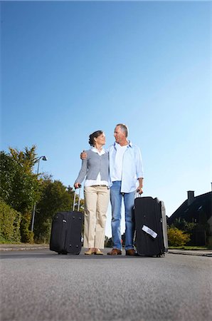 simsearch:649-05520995,k - Mature couple with wheelie cases Stock Photo - Premium Royalty-Free, Code: 649-02732601