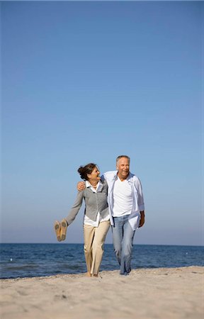 simsearch:649-07520161,k - Mature couple walking along beach Stock Photo - Premium Royalty-Free, Code: 649-02732629