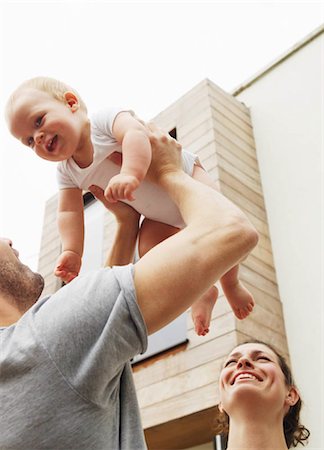 simsearch:673-06964589,k - Father holding baby in the air Stock Photo - Premium Royalty-Free, Code: 649-02733171