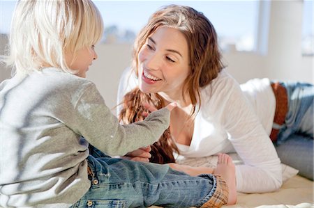 simsearch:400-05119279,k - Mother and child cuddling and playing Stock Photo - Premium Royalty-Free, Code: 649-03010046