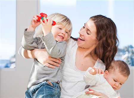 simsearch:400-05119279,k - Mother and children cuddling and playing Stock Photo - Premium Royalty-Free, Code: 649-03010049