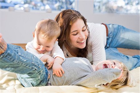 simsearch:400-05119279,k - Mother and children cuddling and playing Stock Photo - Premium Royalty-Free, Code: 649-03010051