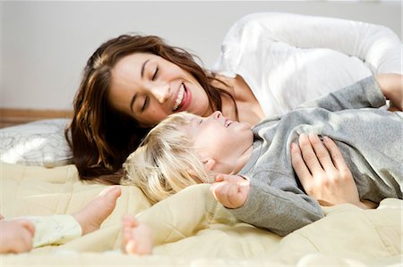 simsearch:400-05119279,k - Mother and children cuddling and playing Stock Photo - Premium Royalty-Free, Code: 649-03010052