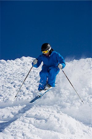 simsearch:649-03857163,k - Man in blue skiing down hill. Stock Photo - Premium Royalty-Free, Code: 649-03077561