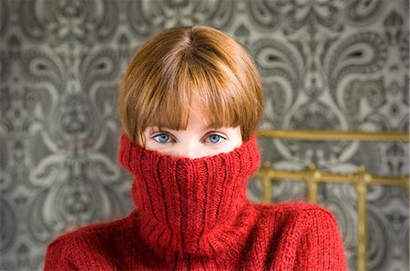 embarrassed women - woman with jumper pulled over face Stock Photo - Premium Royalty-Free, Code: 649-03078752