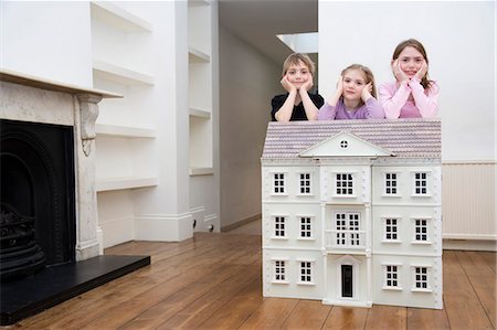 simsearch:649-03769746,k - Three children resting on a dollhouse. Stock Photo - Premium Royalty-Free, Code: 649-03153517