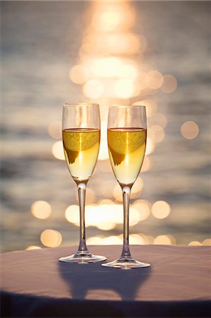 Two glasses of champagne at sunset Stock Photo - Premium Royalty-Free, Code: 649-03153630