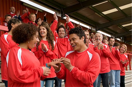 romantic pic in football - Marriage proposal at football match Stock Photo - Premium Royalty-Free, Code: 649-03153780