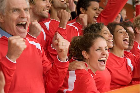 Fans celebrating at football match Stock Photo - Premium Royalty-Free, Code: 649-03153798