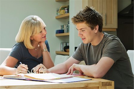simsearch:6108-06166629,k - Mother helping son with homework Stock Photo - Premium Royalty-Free, Code: 649-03153829