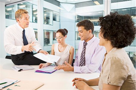 simsearch:655-03458001,k - A senior male heads a business meeting Stock Photo - Premium Royalty-Free, Code: 649-03153996