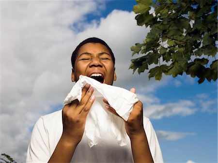 boy sneezing outside Stock Photo - Premium Royalty-Free, Code: 649-03296038