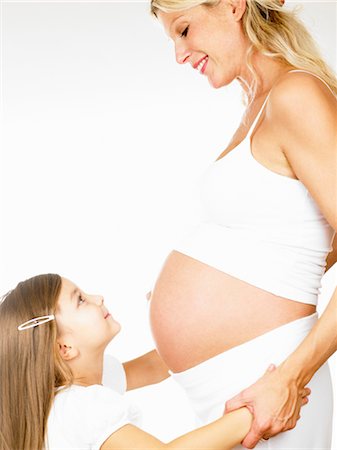 Girl with her pregnant mother Stock Photo - Premium Royalty-Free, Code: 649-03296457