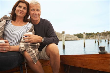 simsearch:6113-07242393,k - Middle aged couple cuddling on old boat Stock Photo - Premium Royalty-Free, Code: 649-03296478