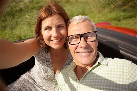 Mid-aged Couple in car self-portrait Stock Photo - Premium Royalty-Free, Code: 649-03296545