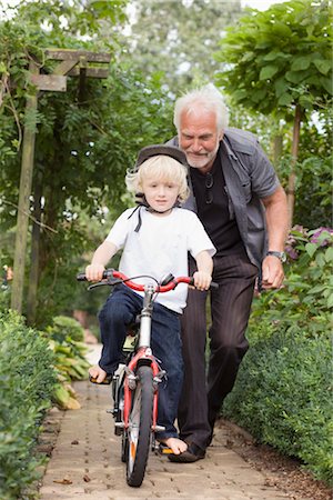 learning to ride a bicycle Stock Photo - Premium Royalty-Free, Code: 649-03297290