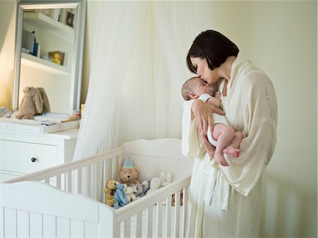 A mother holding a new born baby Stock Photo - Premium Royalty-Free, Code: 649-03297405