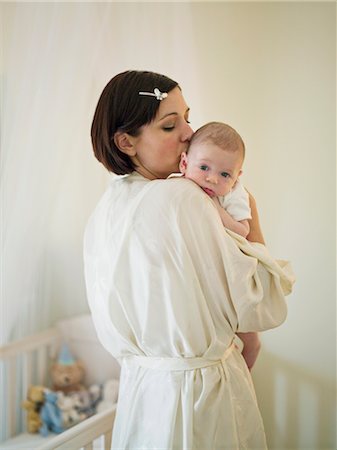 simsearch:400-05119279,k - A mother holding a new born baby Stock Photo - Premium Royalty-Free, Code: 649-03297407