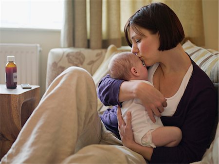 simsearch:400-05119279,k - A mother kissing her new baby Stock Photo - Premium Royalty-Free, Code: 649-03297402