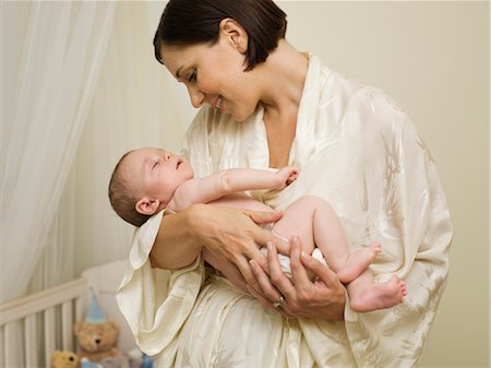 simsearch:400-05119279,k - A mother holding a new born baby Stock Photo - Premium Royalty-Free, Code: 649-03297415