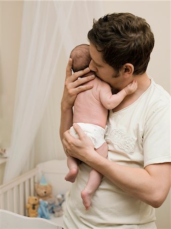 simsearch:632-08001820,k - A father holding his new born baby Stock Photo - Premium Royalty-Free, Code: 649-03297412