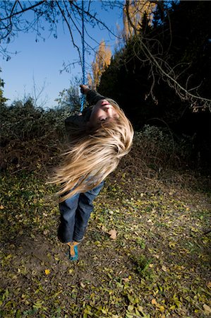 simsearch:614-08030822,k - Girl standing on a tree swing Stock Photo - Premium Royalty-Free, Code: 649-03297553