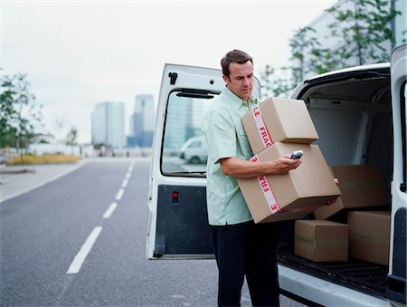 simsearch:649-07119141,k - A courier delivers Parcels Stock Photo - Premium Royalty-Free, Code: 649-03297642