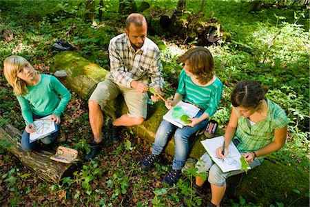 environmental sciences - teacher and pupils at the wood Stock Photo - Premium Royalty-Free, Code: 649-03291860