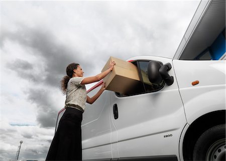 woman with large box and delivery van Stock Photo - Premium Royalty-Free, Code: 649-03292122